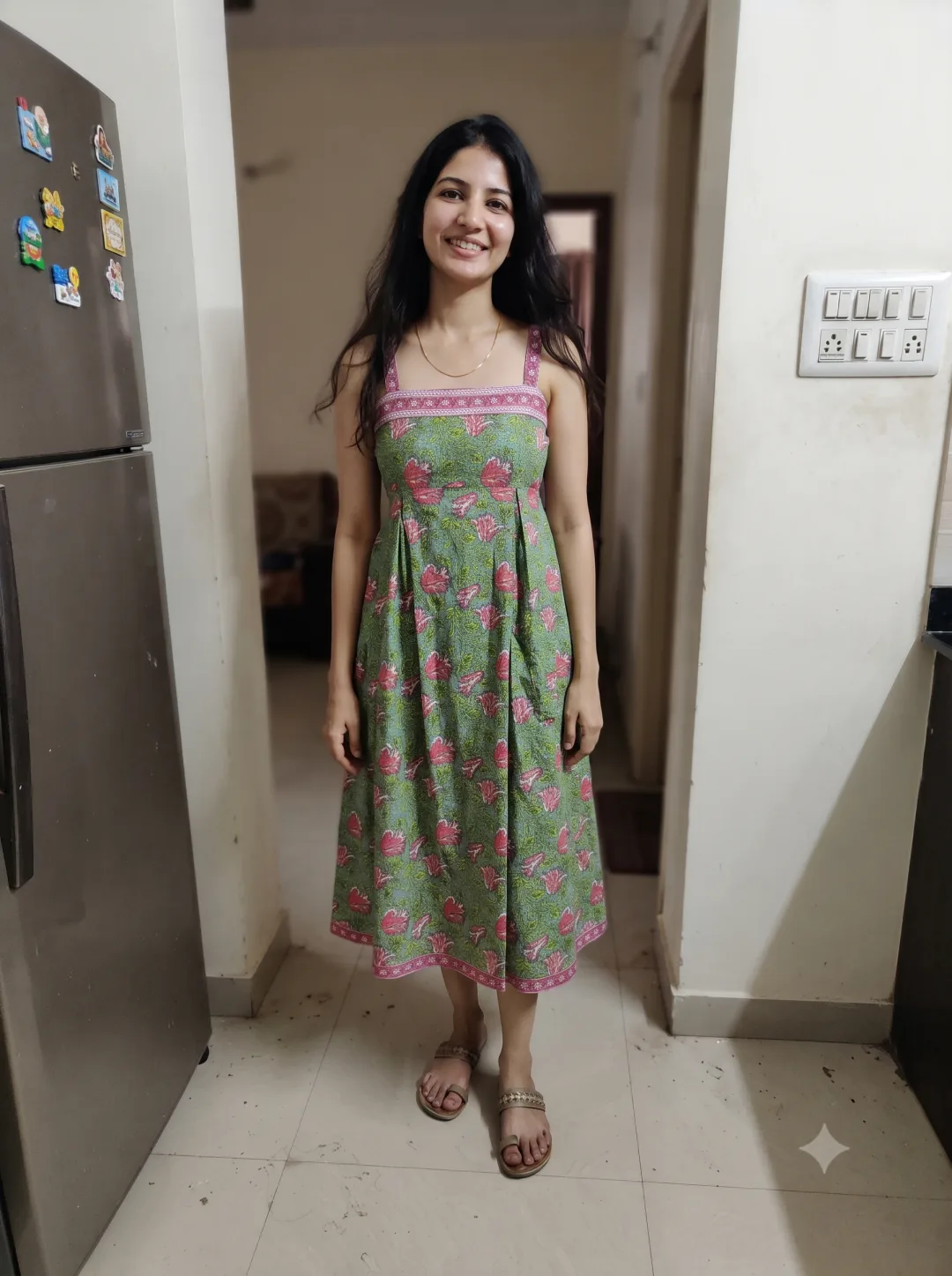 Aditi wearing the green floral cotton midi