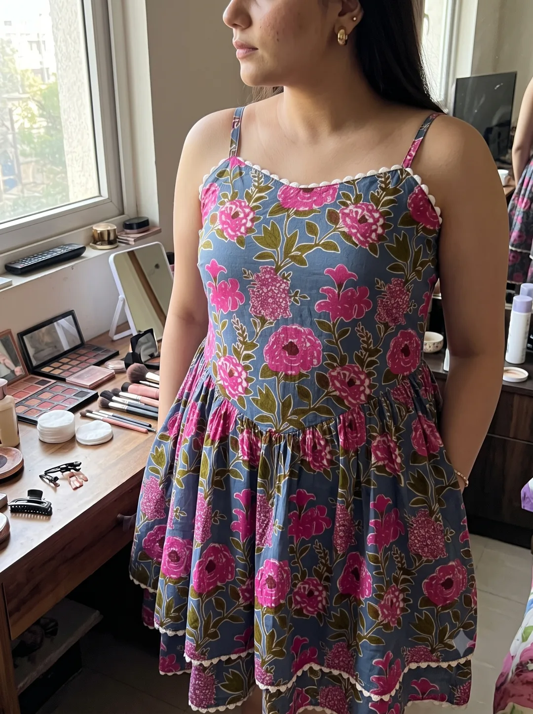 Kavya wearing the grey floral fit and flare dress