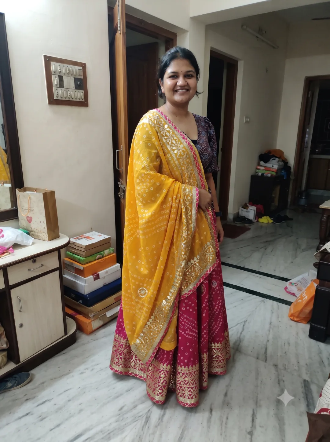 Customer wearing Pink Embellished Stitched Kota Doria Lehenga with Gota Patti