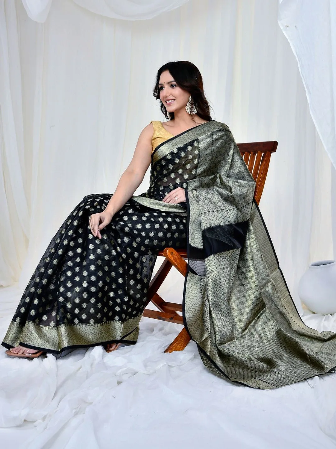 Woven zari on black Kota Doria Banarasi — seated detail