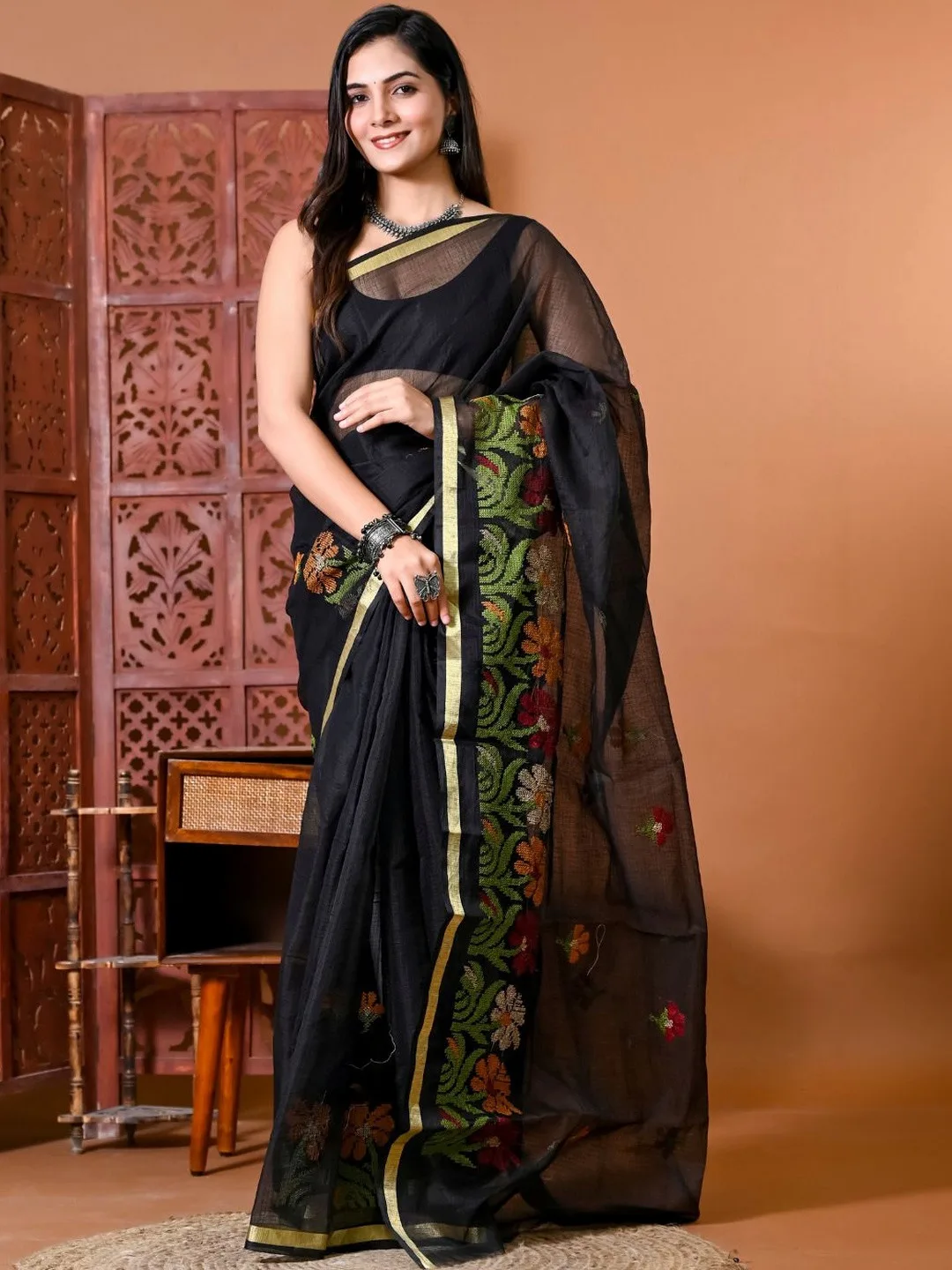 Black Kota Doria saree with golden zari border — back view