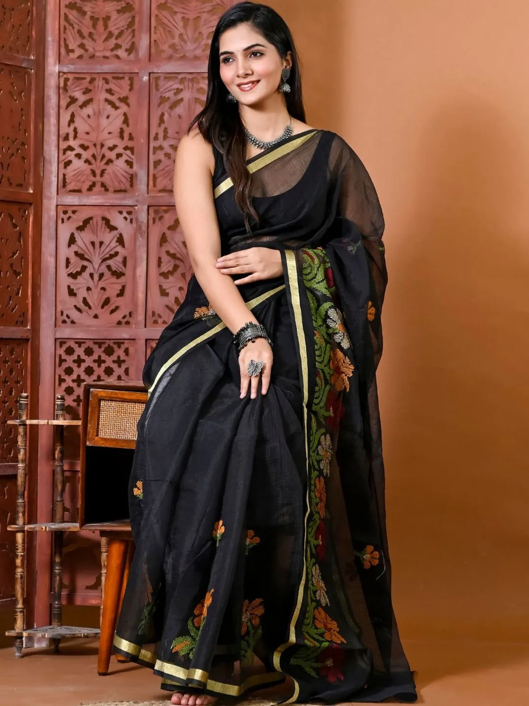 Floral embroidery and golden zari border — detail