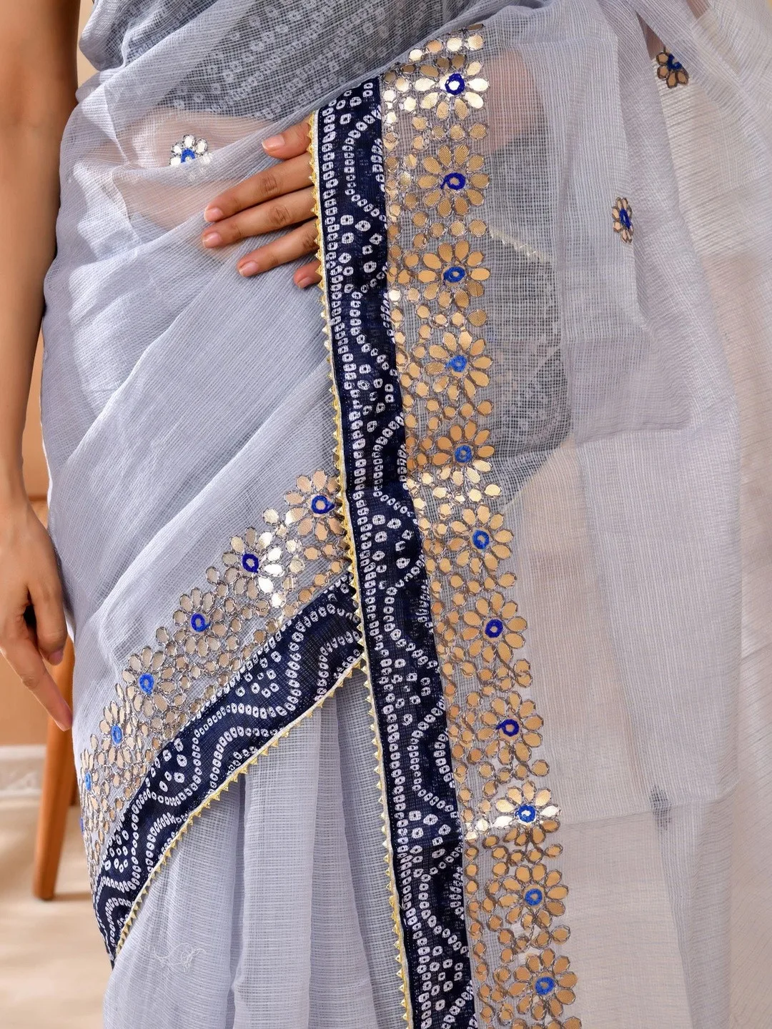 Gota patti on grey Kota Doria with a solid border — detail
