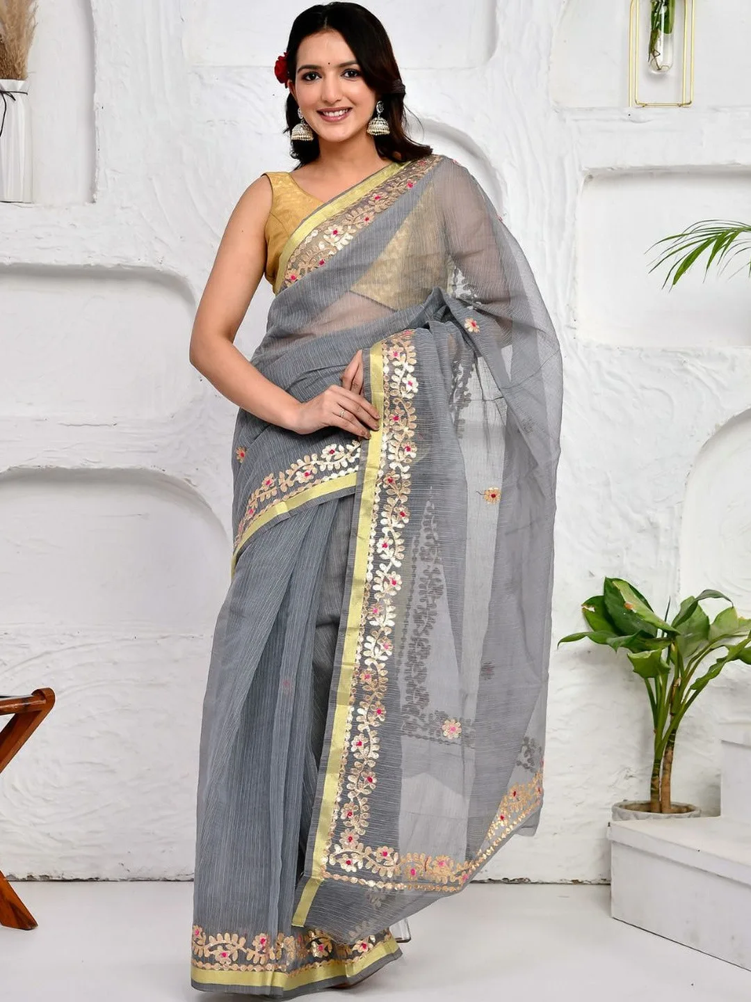 Gota patti on grey Kota Doria with a zari border — detail