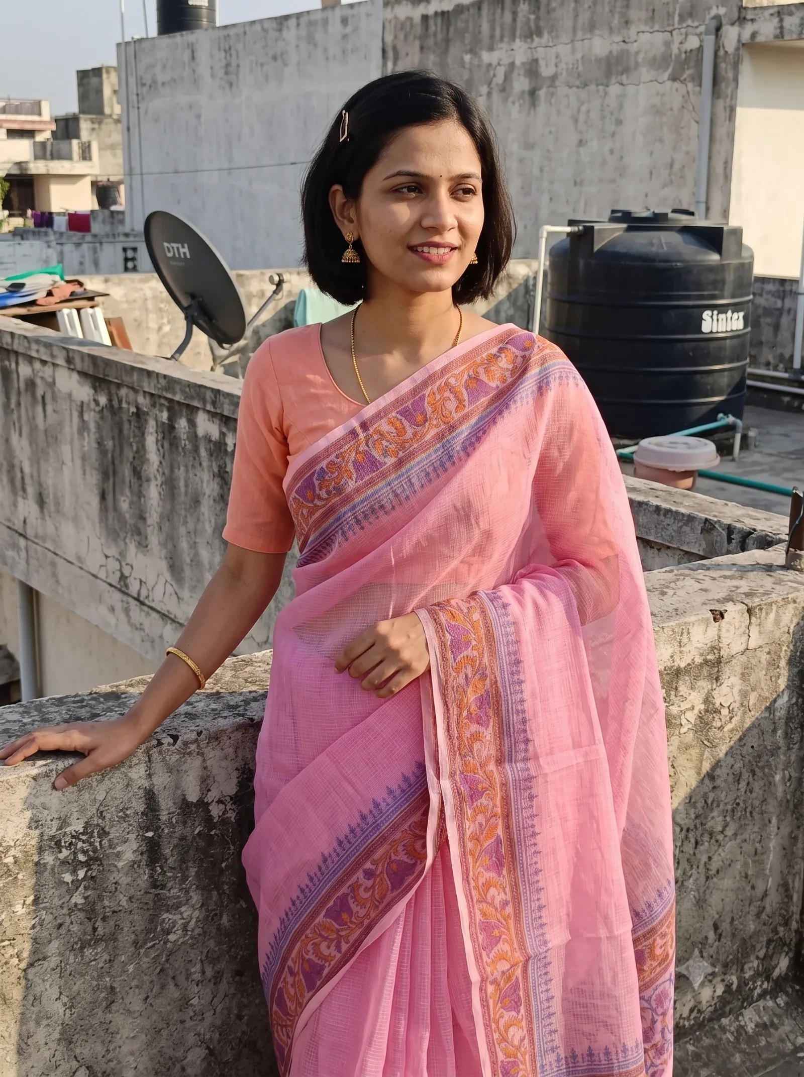 Customer wearing pink ethnic motifs saree