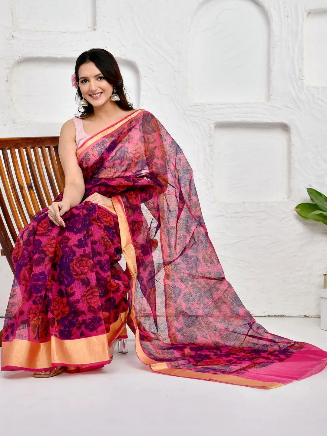 Floral print and zari border on pink Kota Doria — detail