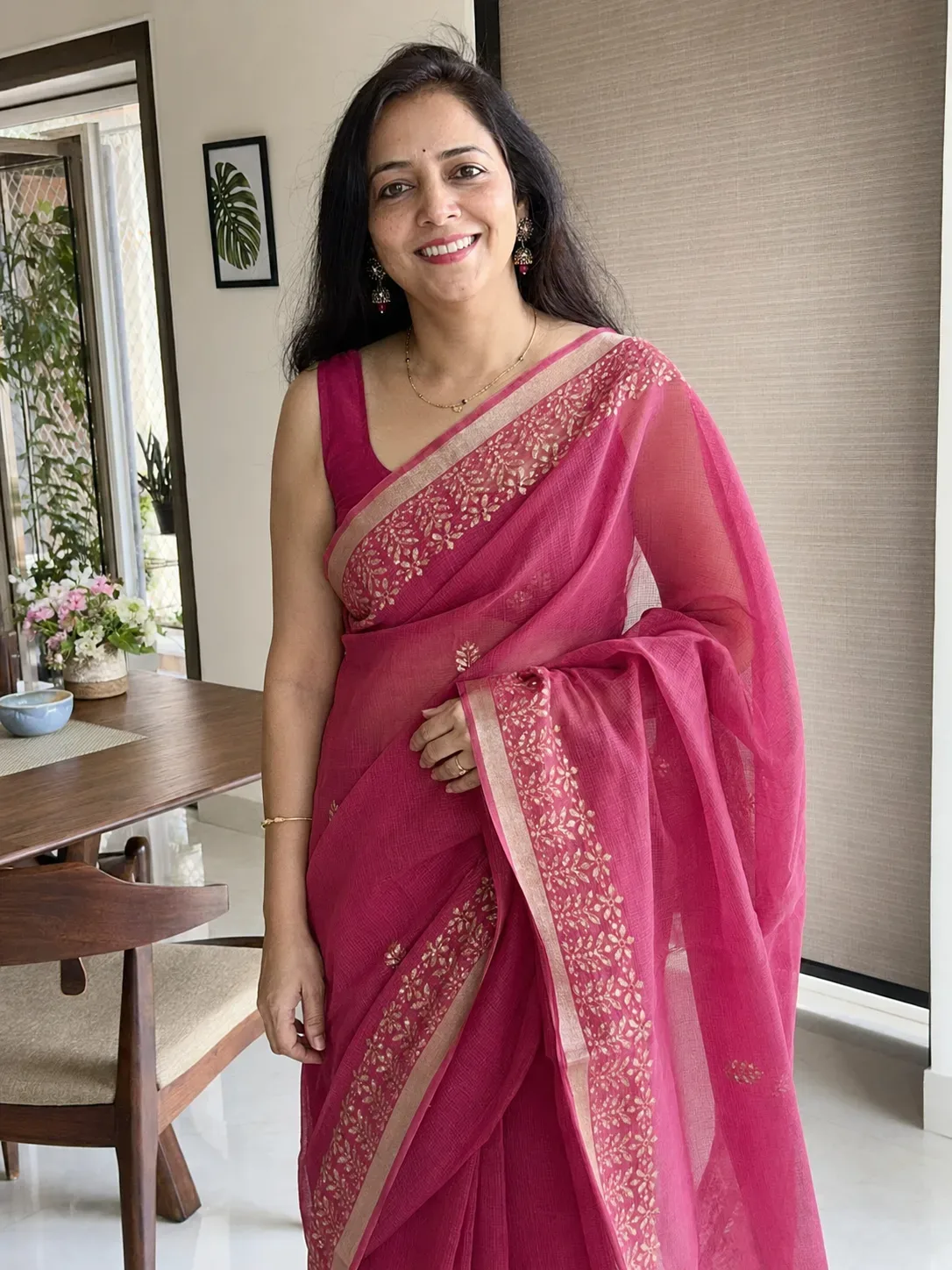 Meera wearing the pink Kota Doria saree at home