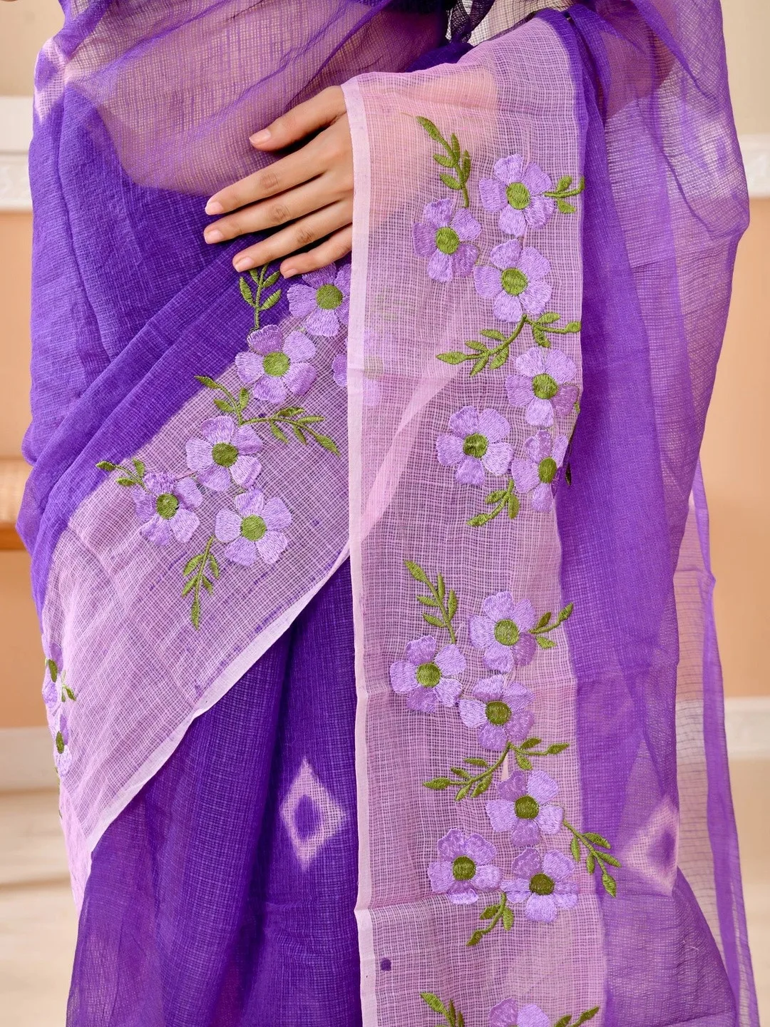 Floral embroidery and embellished border on purple Kota Doria — detail