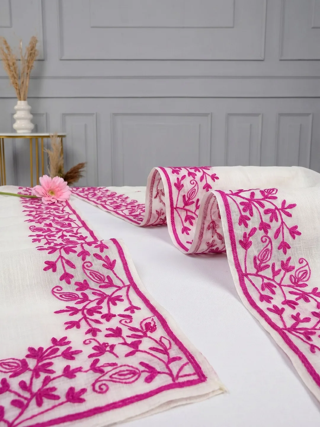 Embroidered ethnic motifs on white Kota Doria — detail